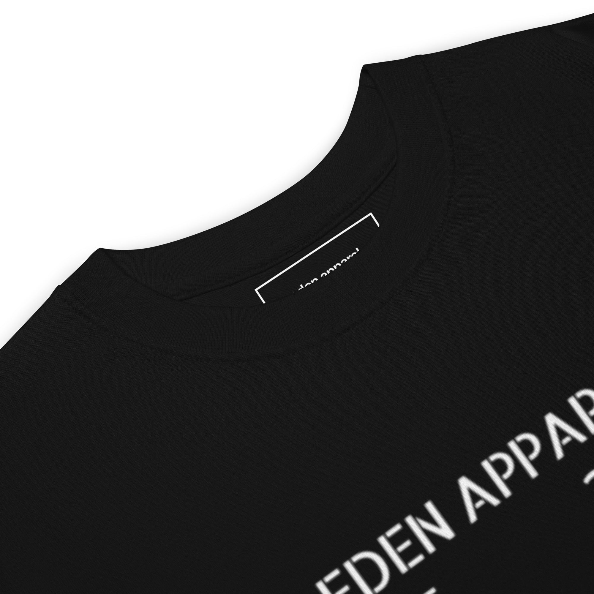 Black t-shirt with 'eden apparel.' inside tag branding on a white background